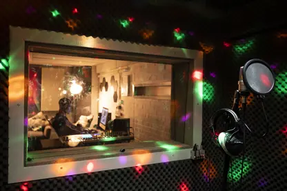 Music producer seen through studio window